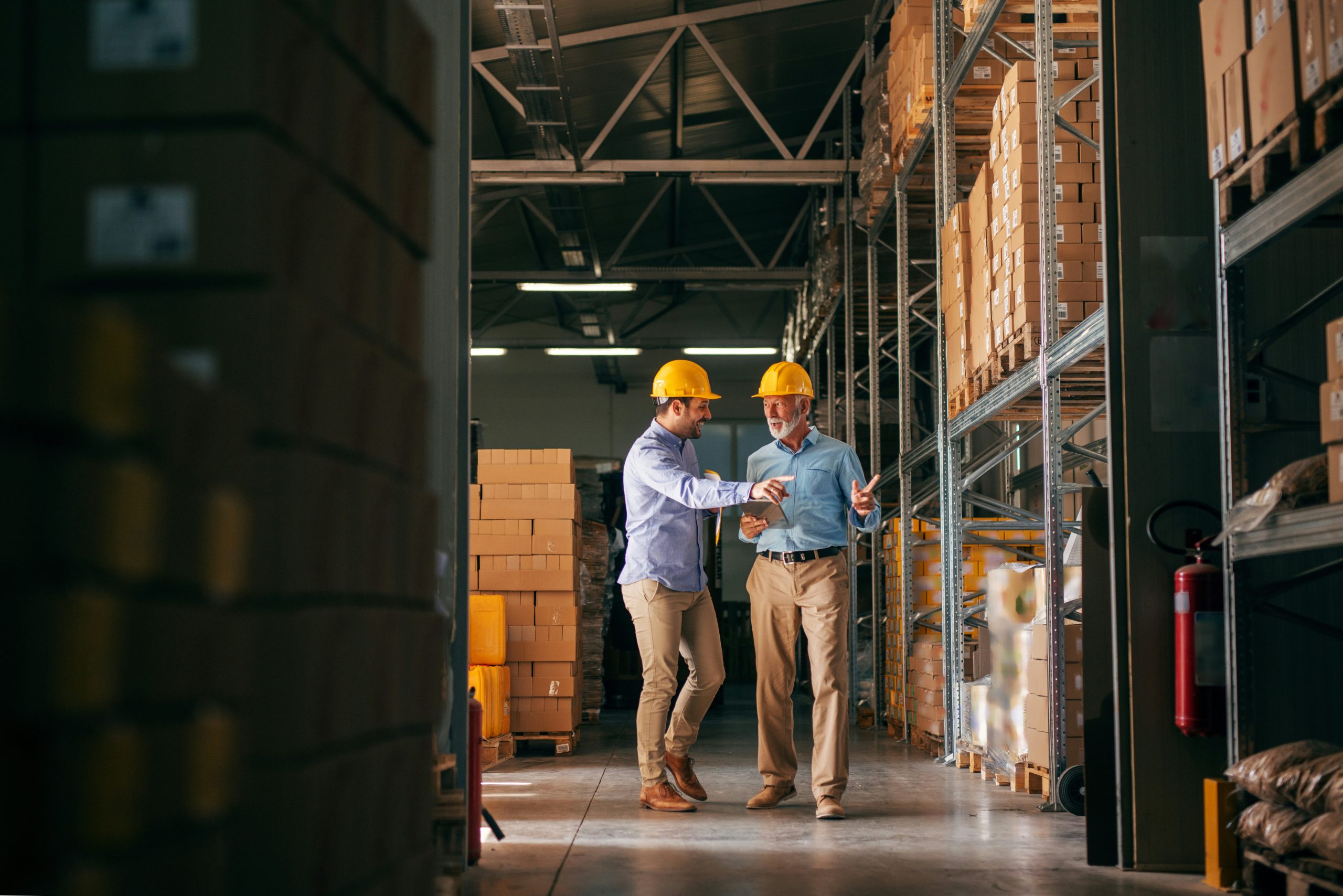 Operations leaders reviewing warehouse inventory and execution using data-driven insights.
