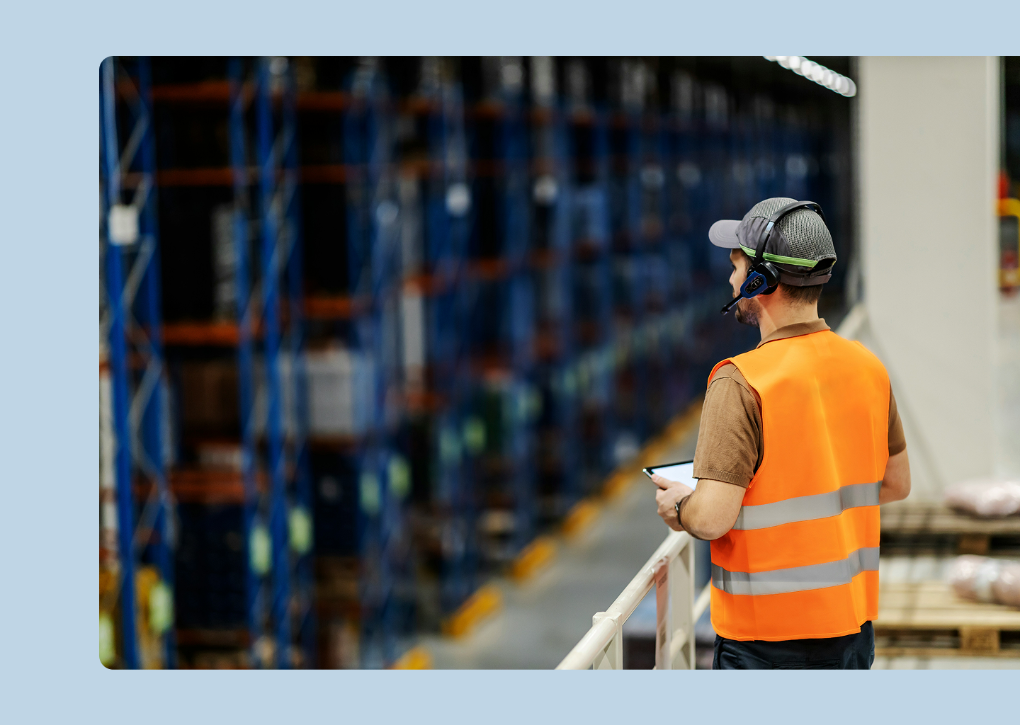 Warehouse operator using digital tools to monitor material availability and identify potential shortages.